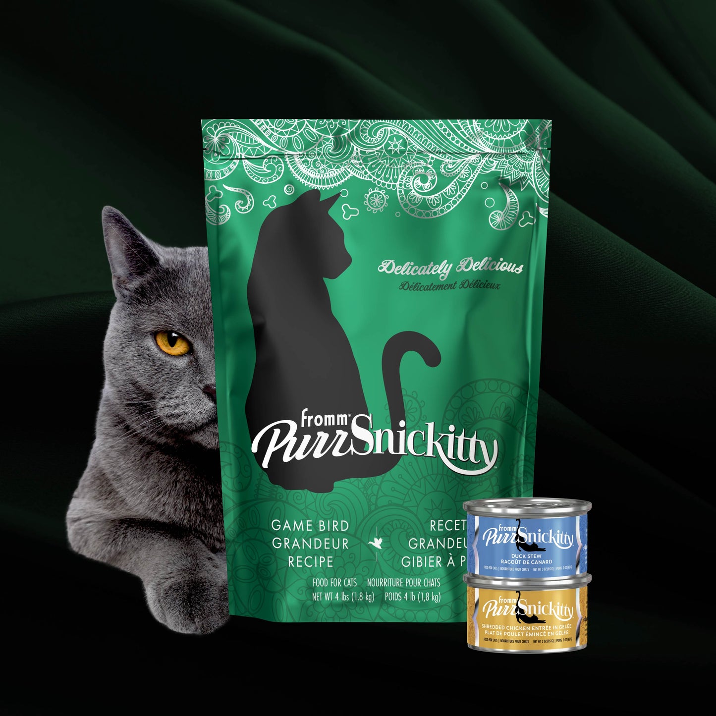 Green bag of PurrSnickitty cat food with a gray cat and two cans on a black background